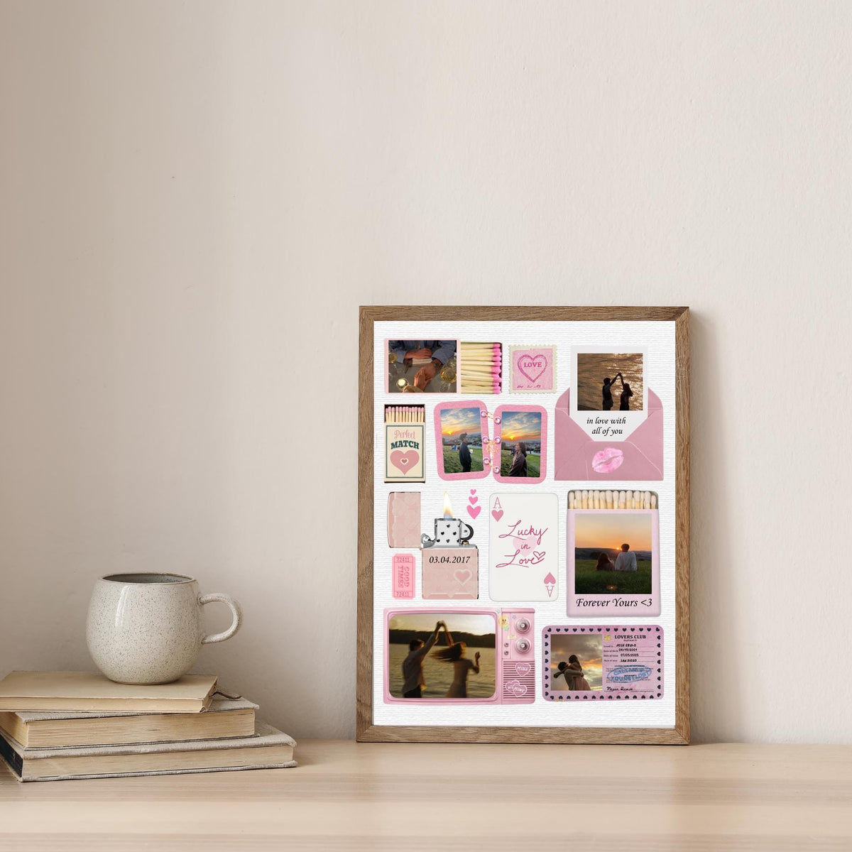 Pink couple matchbook design in a wooden frame beside books and a mug